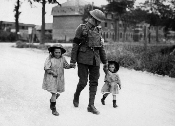 Soldier with two little girls, France, during World War I