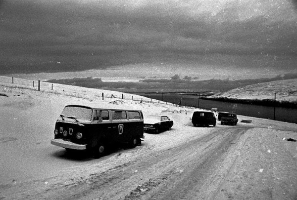 A Snow Covered Road and Cars in the Shetland Islands