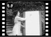 An open-air lecture by Margaret Baker telling the story about the dangers of drink, and propounding the benefits of drinking milk