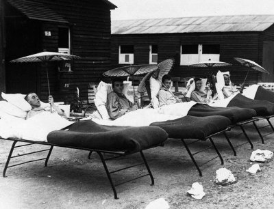 Five soldiers recuperating in the sun, during World War I