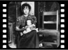 A young mother in a slum kitchen probably in about 1890