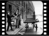 Man piling furniture onto a cart, Gorbals